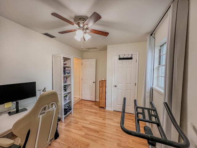 office space featuring ceiling fan and light hardwood / wood-style flooring