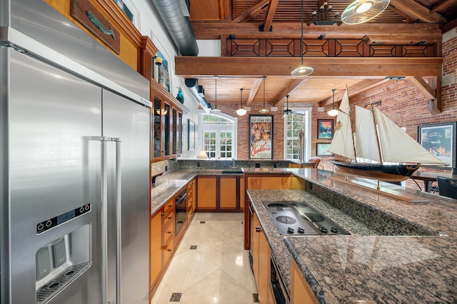 kitchen with brick wall, pendant lighting, electric stovetop, built in refrigerator, and wood ceiling