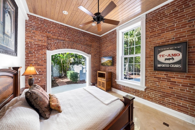 bedroom with ornamental molding, brick wall, multiple windows, and wooden ceiling