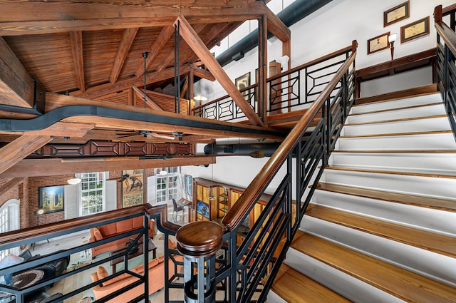 staircase with ceiling fan