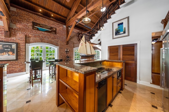 kitchen with high vaulted ceiling, dark stone counters, wooden ceiling, brick wall, and beam ceiling