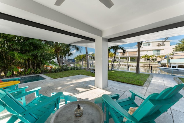 188 Indian Mound Trl, Islamorada, FL 33036 - view of patio / terrace featuring ceiling fan, a water view, an outdoor pool, and a dock