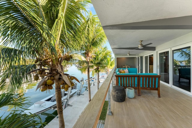 188 Indian Mound Trl, Islamorada, FL 33036 - wooden terrace with a ceiling fan and an outdoor living space