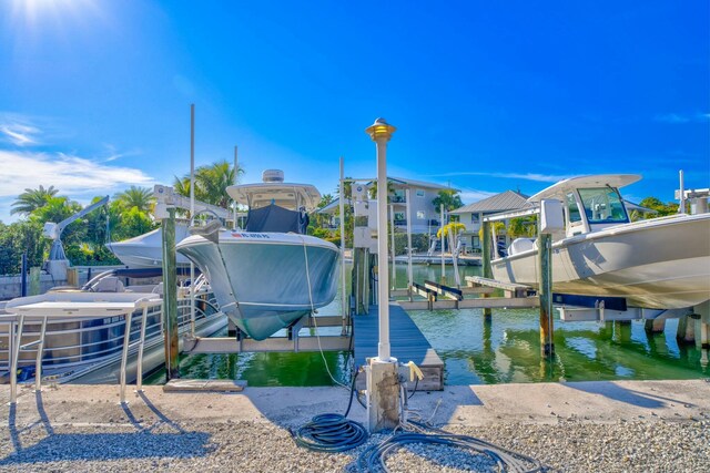 view of dock with a water view and boat lift