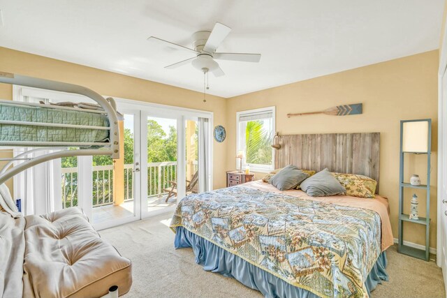 carpeted bedroom featuring access to outside and ceiling fan