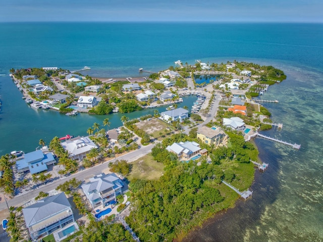 birds eye view of property featuring a water view and a residential view