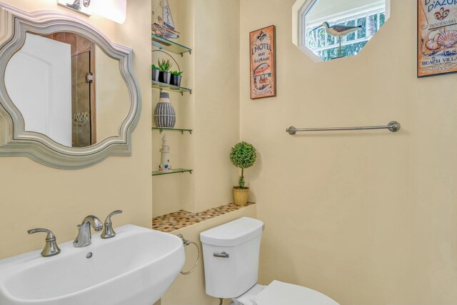 bathroom featuring a sink and toilet