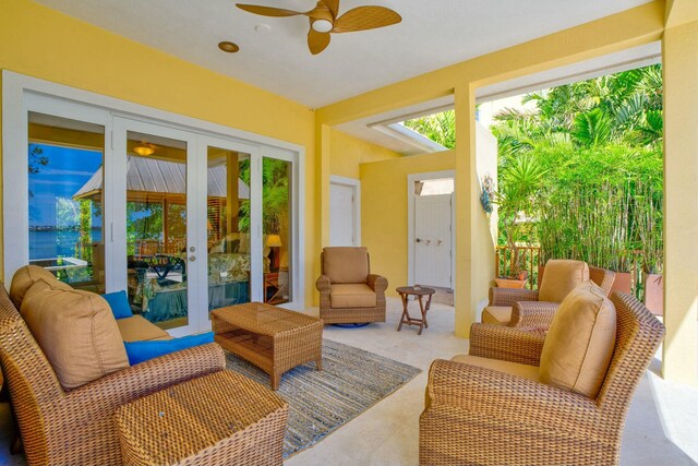 sunroom with french doors and ceiling fan