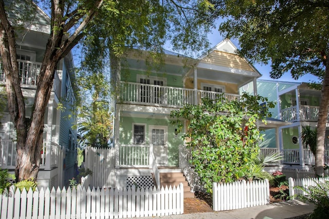 view of front of property featuring a balcony