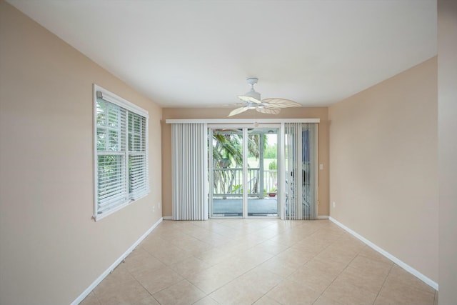 unfurnished room featuring light tile patterned floors and ceiling fan