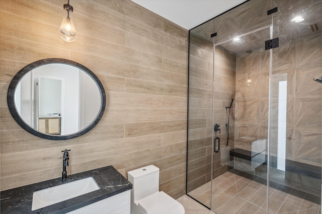 194 Buttonwood Ln, Islamorada, FL 33036 - bathroom featuring a shower stall, vanity, and tile walls