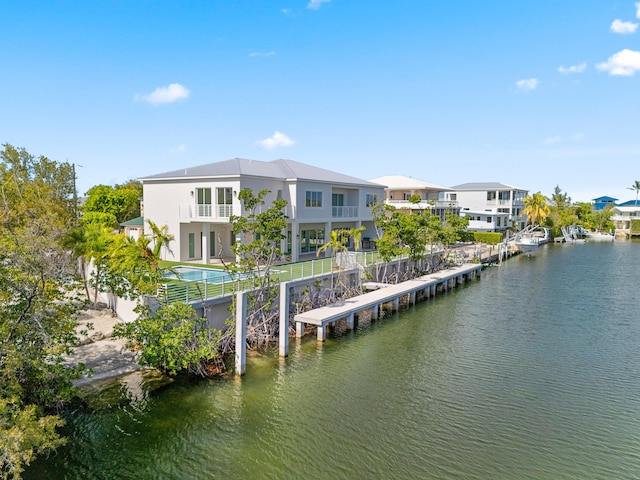 194 Buttonwood Ln, Islamorada, FL 33036 - dock area featuring a water view and a residential view