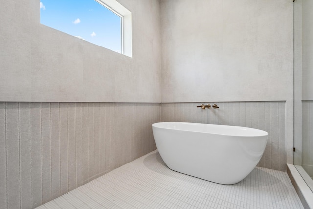 194 Buttonwood Ln, Islamorada, FL 33036 - bathroom featuring a soaking tub and tile patterned flooring