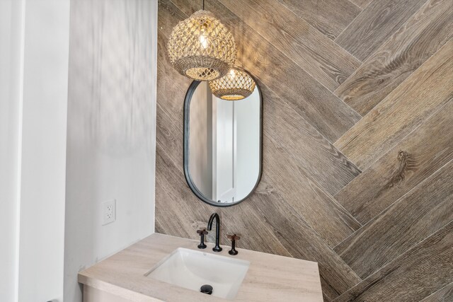 194 Buttonwood Ln, Islamorada, FL 33036 - bathroom with a sink and a chandelier