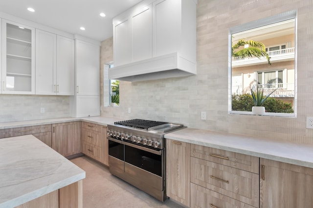 194 Buttonwood Ln, Islamorada, FL 33036 - kitchen featuring double oven range, light brown cabinets, light stone counters, backsplash, and recessed lighting