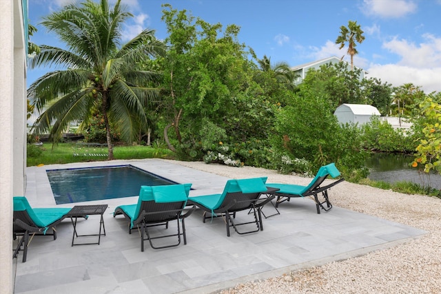 view of swimming pool with a patio area