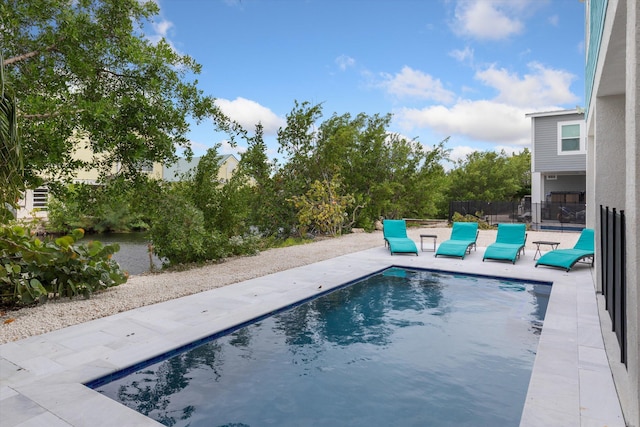 view of swimming pool with a patio