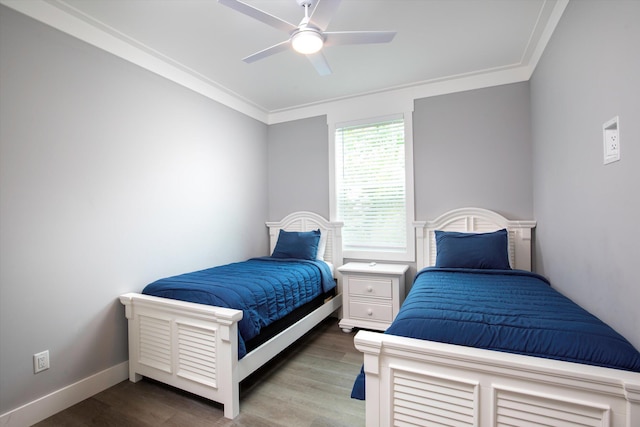 bedroom featuring crown molding, ceiling fan, and hardwood / wood-style floors