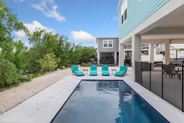 view of swimming pool with a patio