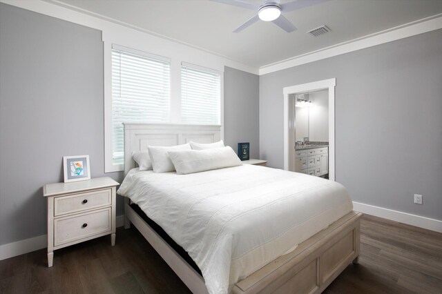 bedroom with dark wood-type flooring, ceiling fan, ornamental molding, and ensuite bathroom