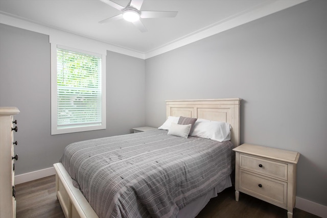 bedroom featuring ornamental molding, ceiling fan, and dark hardwood / wood-style flooring