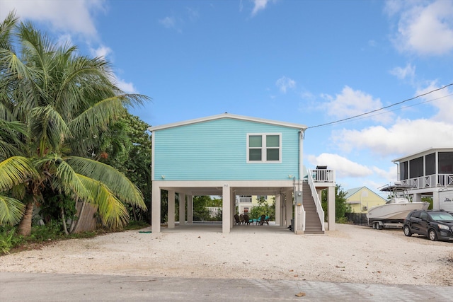 rear view of house featuring a carport