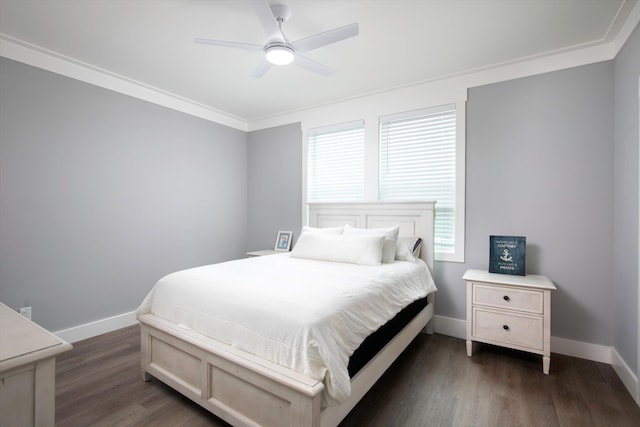 bedroom with ornamental molding, dark hardwood / wood-style floors, and ceiling fan