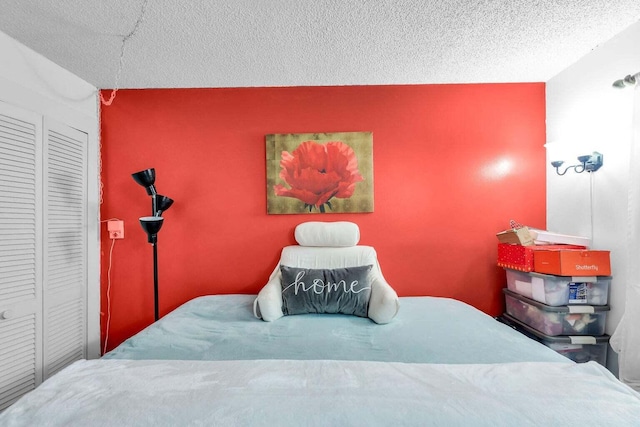 bedroom featuring a textured ceiling