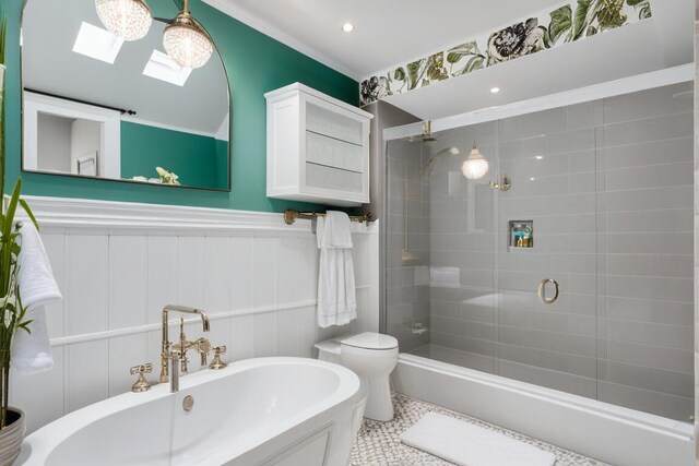 bathroom with a shower with door, toilet, and a skylight