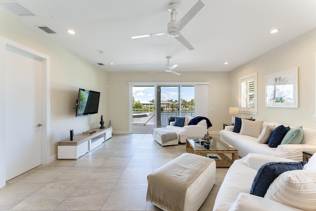 living room featuring visible vents, recessed lighting, baseboards, and a ceiling fan