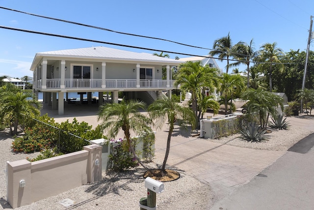 view of property featuring a fenced front yard and driveway