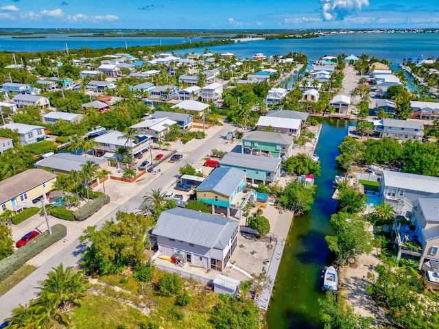 aerial view with a water view and a residential view