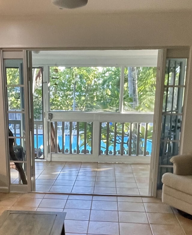 doorway to outside featuring tile patterned floors