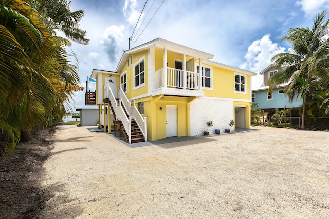 back of property with a garage