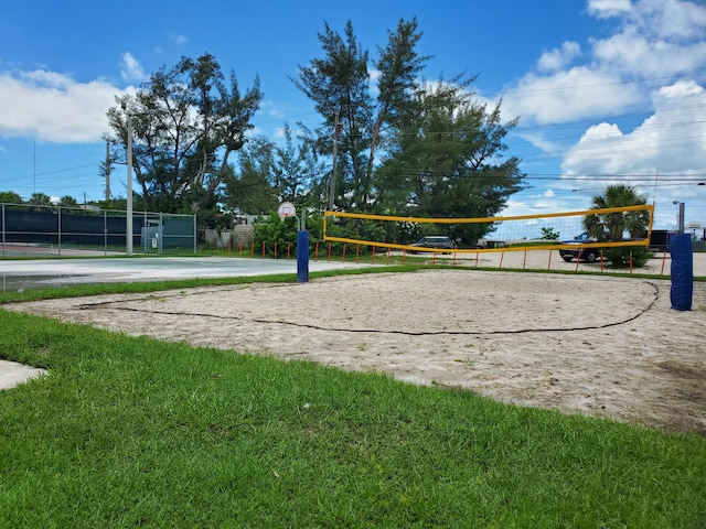 view of community featuring a yard and volleyball court