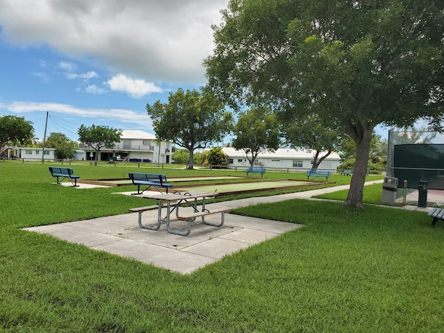 view of home's community with a yard