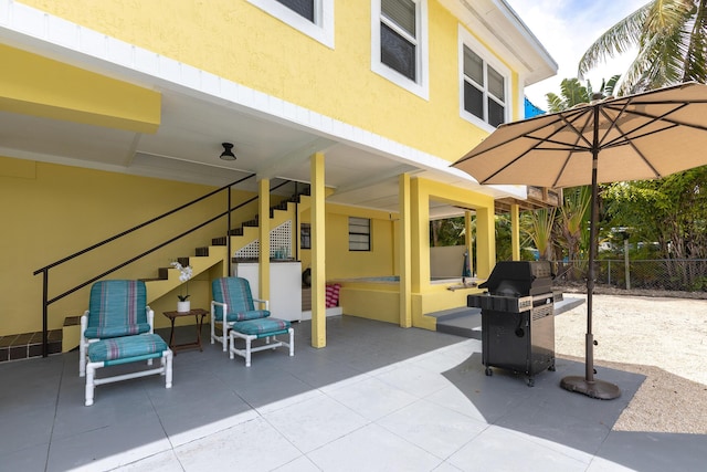 view of patio with a grill