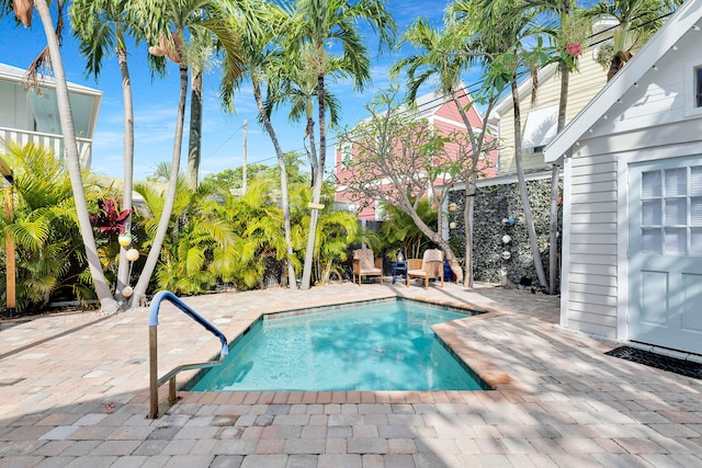 outdoor pool featuring a patio