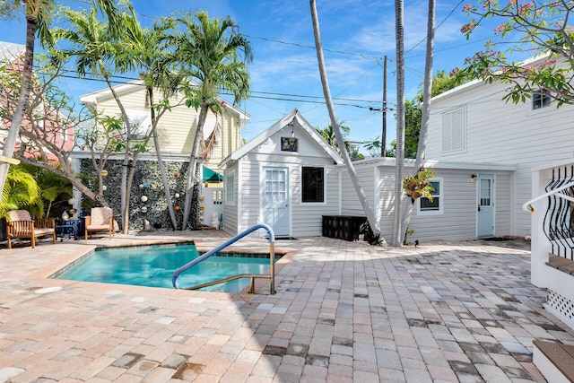 2211 Staples Ave, Key West, FL 33040 - view of swimming pool featuring a fenced in pool, a patio area, and an outbuilding