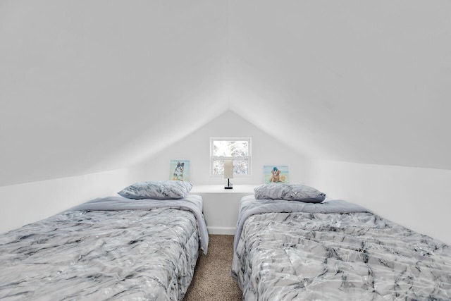 carpeted bedroom with vaulted ceiling