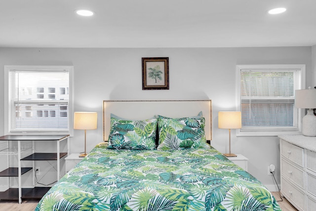 bedroom featuring recessed lighting, baseboards, and light wood-style flooring