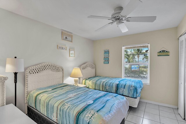 120 9th St, Key Colony, FL 33051 - bedroom with light tile patterned floors and a ceiling fan