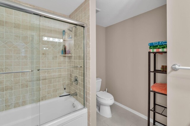 120 9th St, Key Colony, FL 33051 - bathroom featuring tile patterned floors and combined bath / shower with glass door