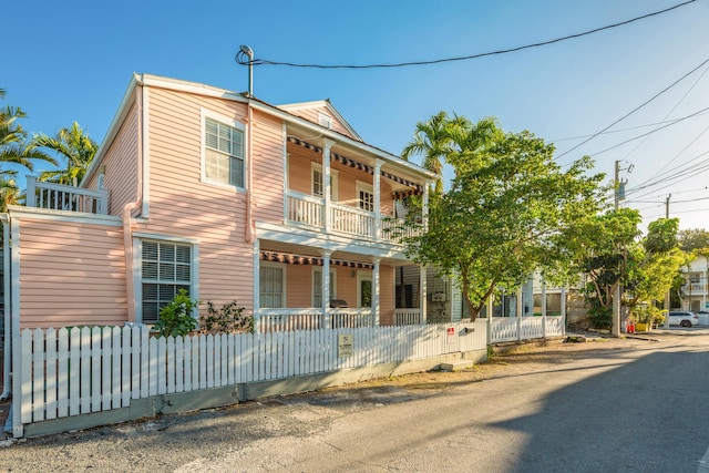 view of front of property with a balcony and covered porch