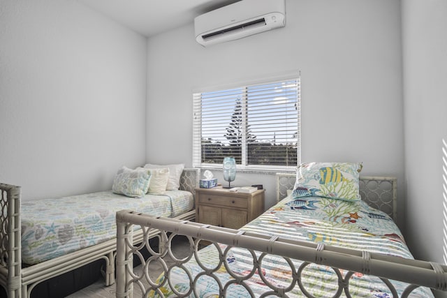 bedroom featuring an AC wall unit