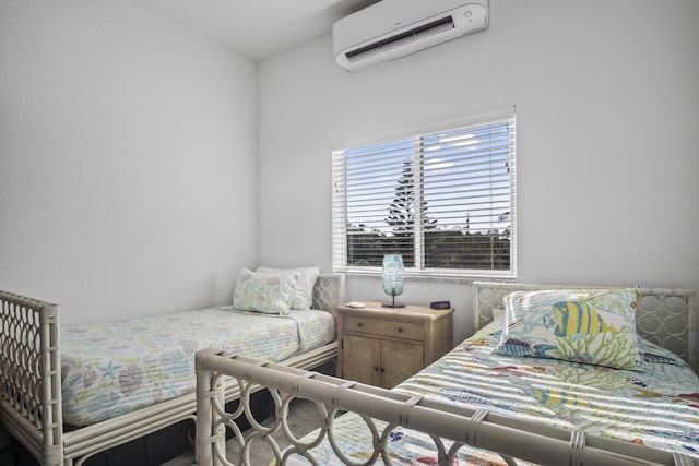 bedroom featuring a wall unit AC