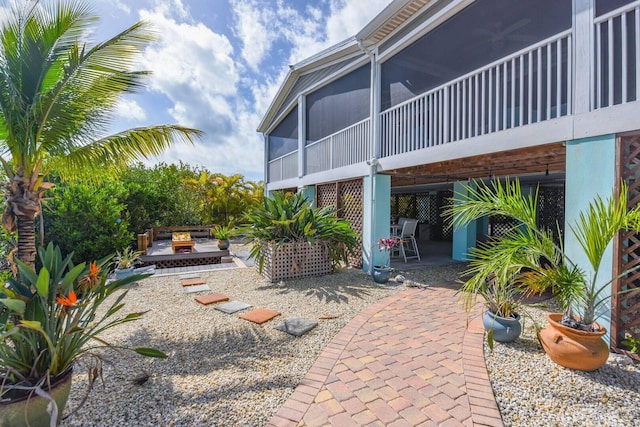 view of patio with a sunroom