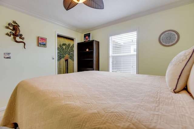 bedroom featuring ceiling fan and ornamental molding