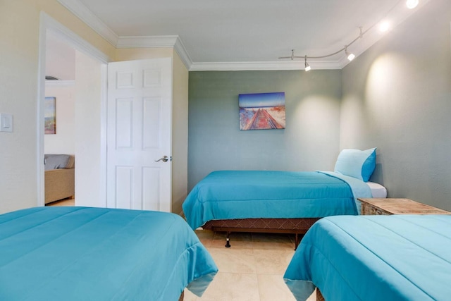 bedroom featuring crown molding, track lighting, and light tile patterned floors