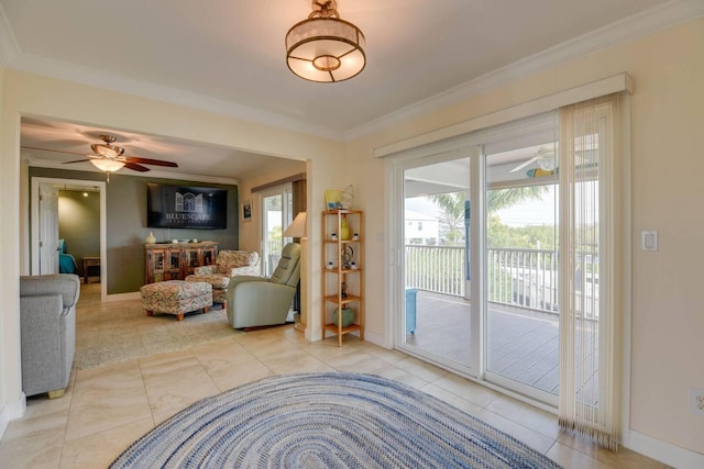 interior space featuring crown molding, a wealth of natural light, and ceiling fan